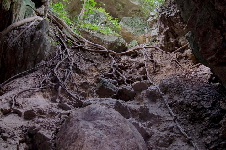 a large waterfall over a rocky cliff