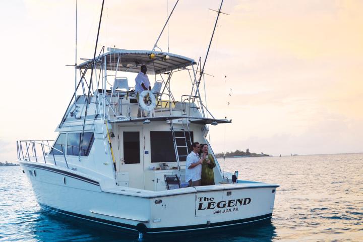 a blue and white boat floating on a large body of water