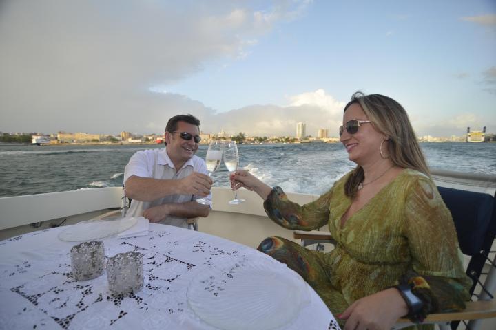 a person standing next to a body of water