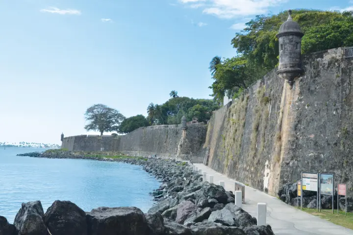 a castle surrounded by a body of water